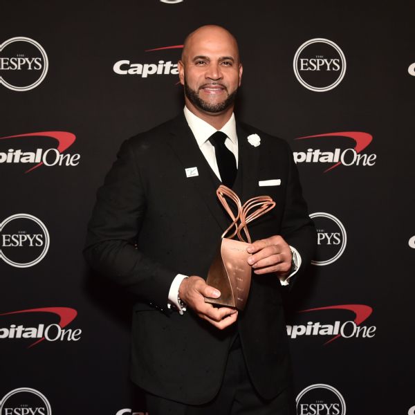 Pujols honored to win Ali award for off-field work