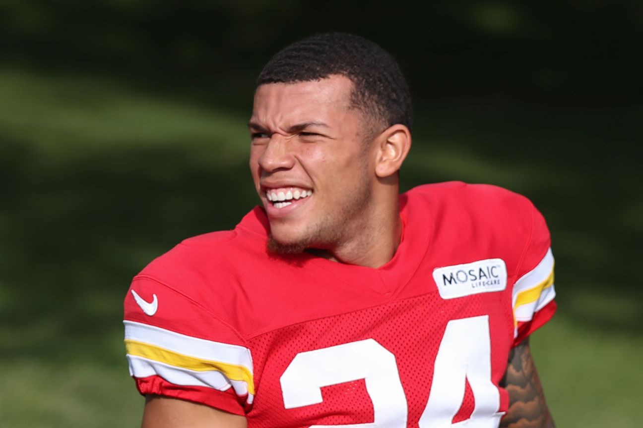 Kansas City Chiefs' Skyy Moore (24) flexes before their NFL football game  against the Arizona Cardinals