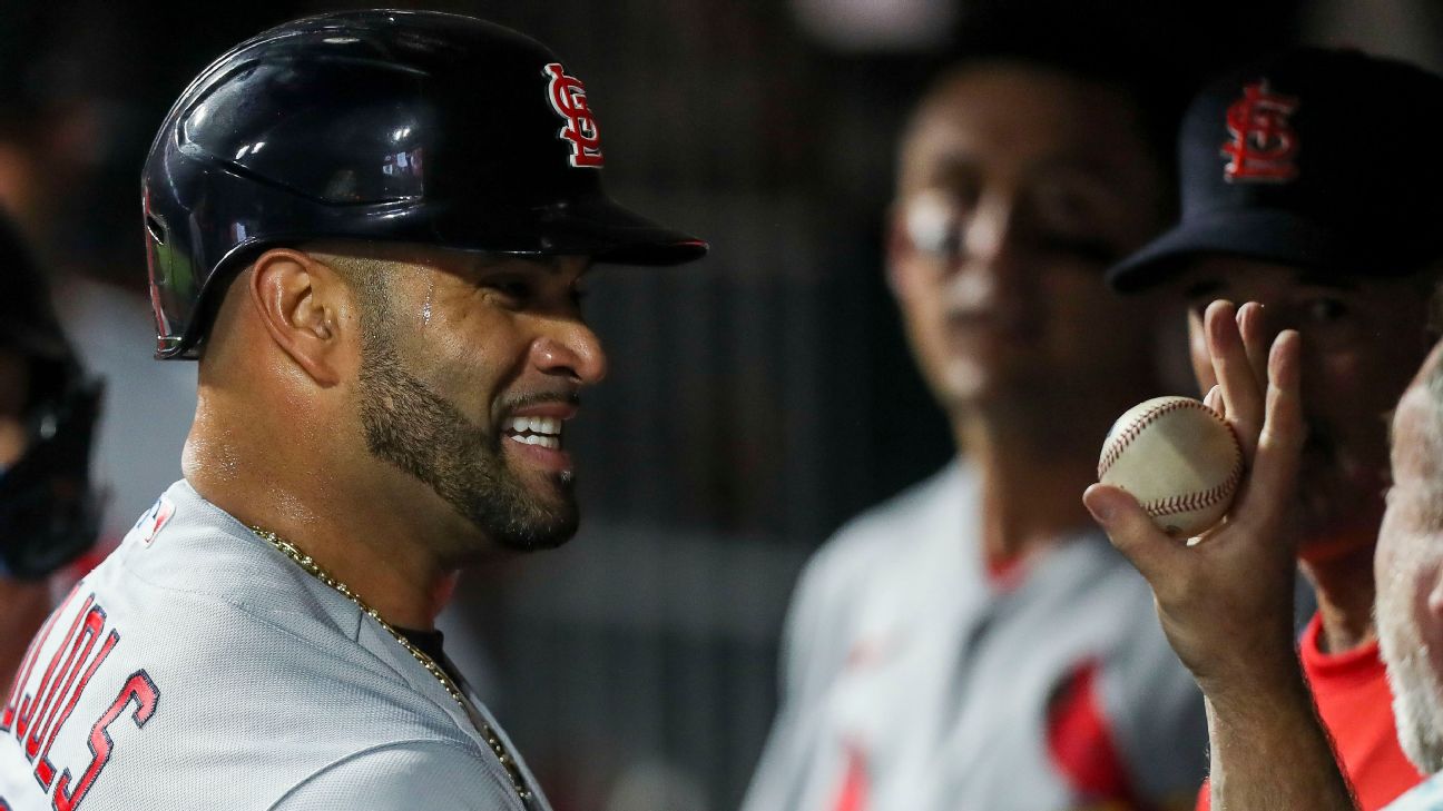 American League's Albert Pujols runs with his son during batting practice  before the Home Run Derby at the 86th All-Star Game at Great American Ball  Park in Cincinnati, Ohio on July 13