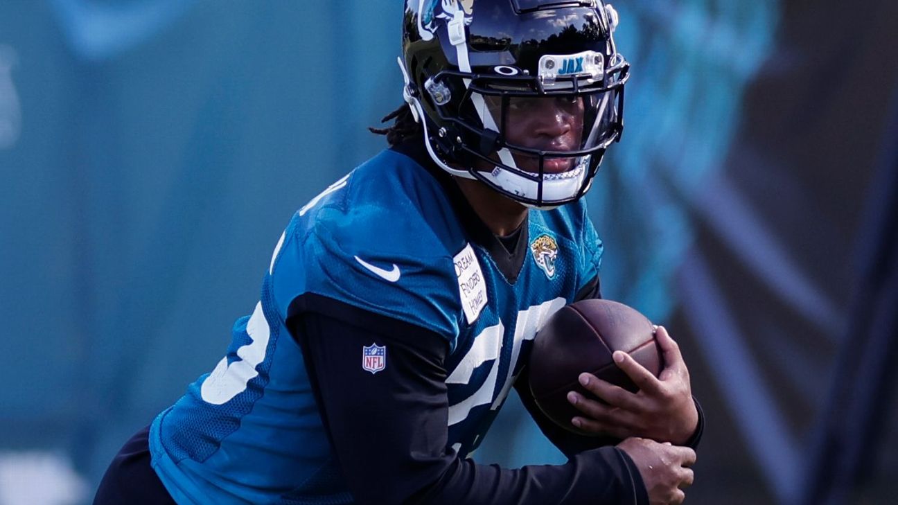 Jacksonville, FL, USA. 19th Sep, 2021. Jacksonville Jaguars running back  James Robinson (25) is pursued by Denver Broncos safety Kareem Jackson (22)  during 2nd half NFL football game between the DenverBroncos and