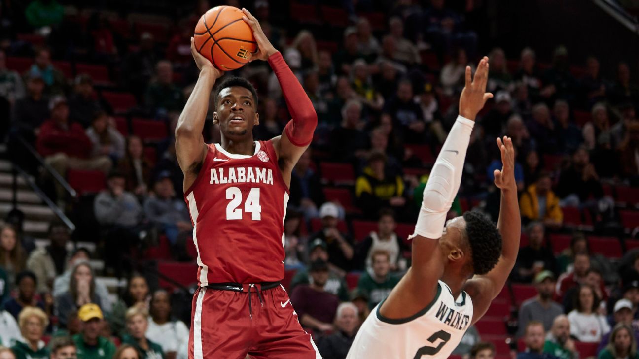 Alabama basketball's Brandon Miller is protected by ARMED SECURITY