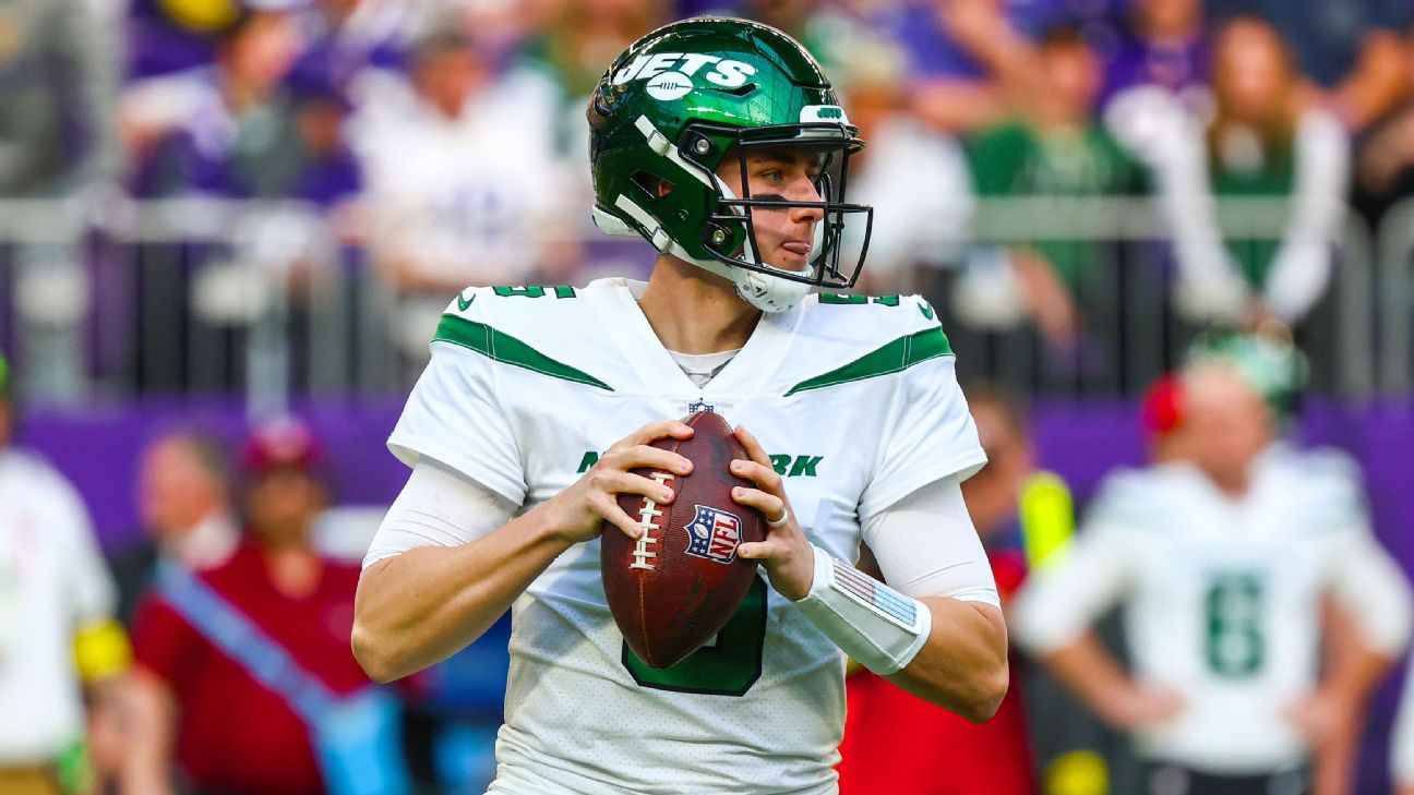 New York Jets quarterback Mike White (5) reacts after scoring a