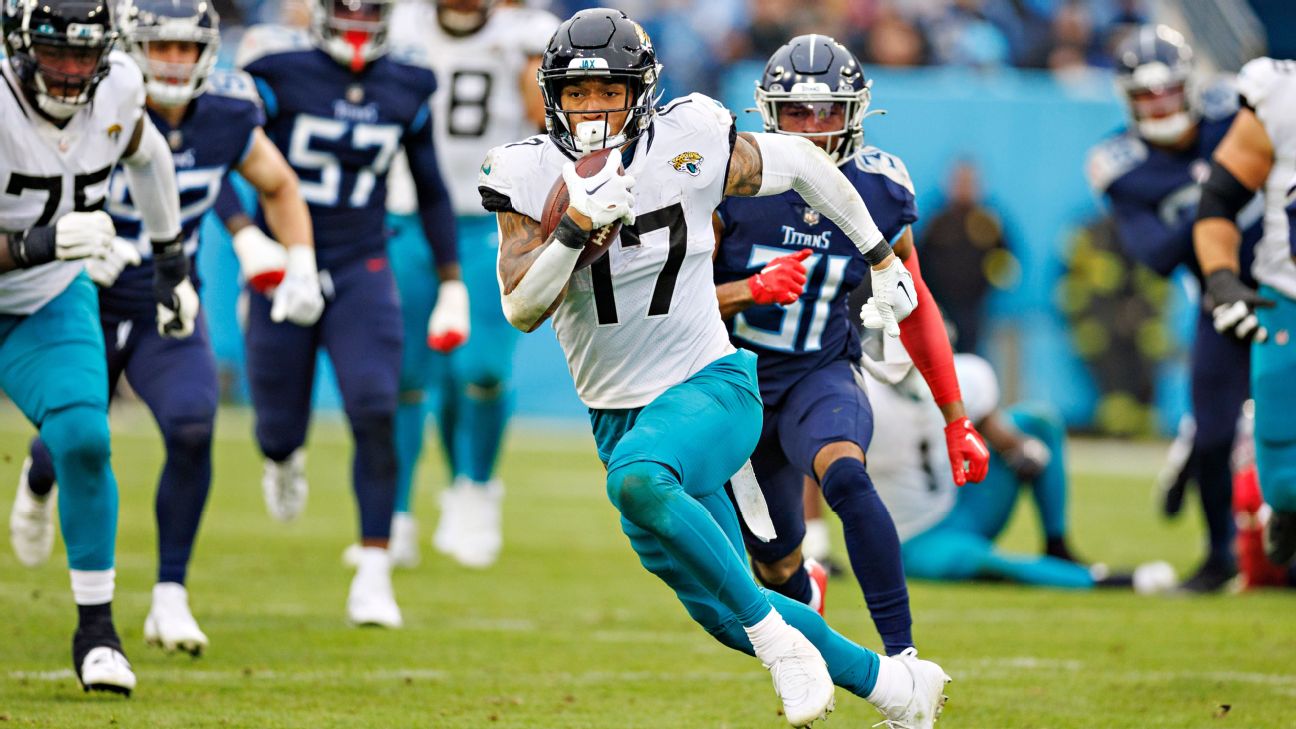 Jacksonville Jaguars tight end Evan Engram (17) runs after the