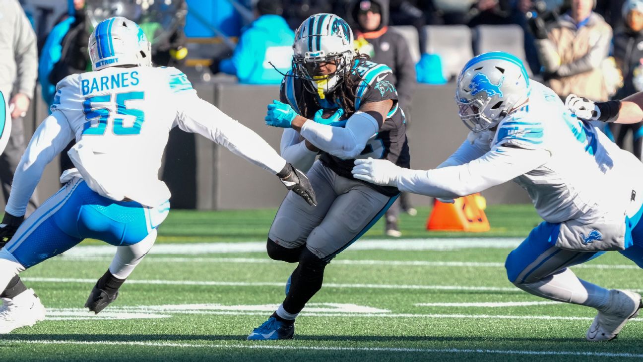 Carolina Panthers tackle Taylor Moton walks to practice at the NFL