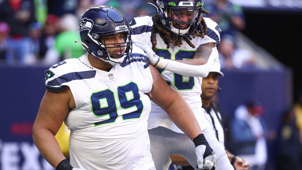 Seattle Seahawks defensive tackle Al Woods (99) reacts after a