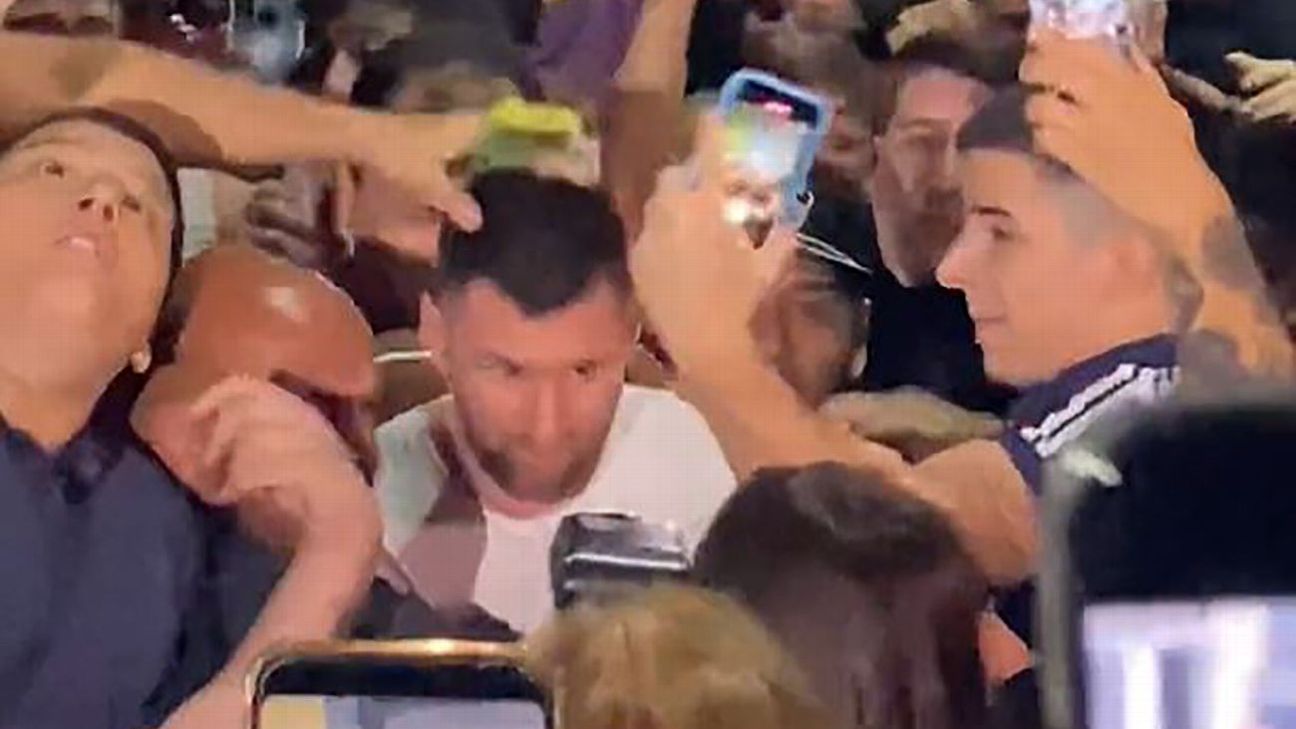 Messi mobbed after 100s of adoring Argentina fans lay siege outside restaurant