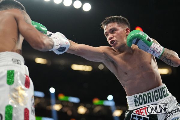 Rodriguez battles jaw injury, claims vacant title