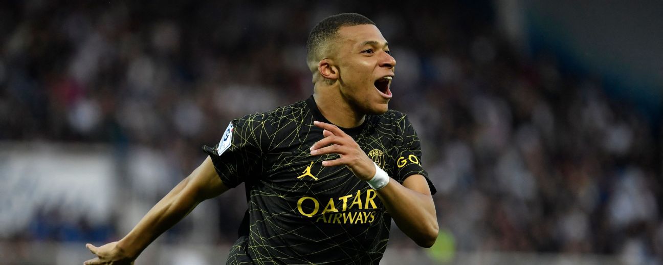 PSG's Kylian Mbappe celebrates after scoring a goal against Auxerre in Ligue 1.