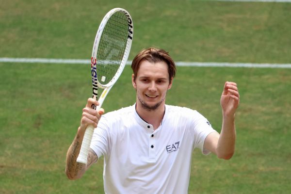 Bublik powers past Rublev to win first grass title