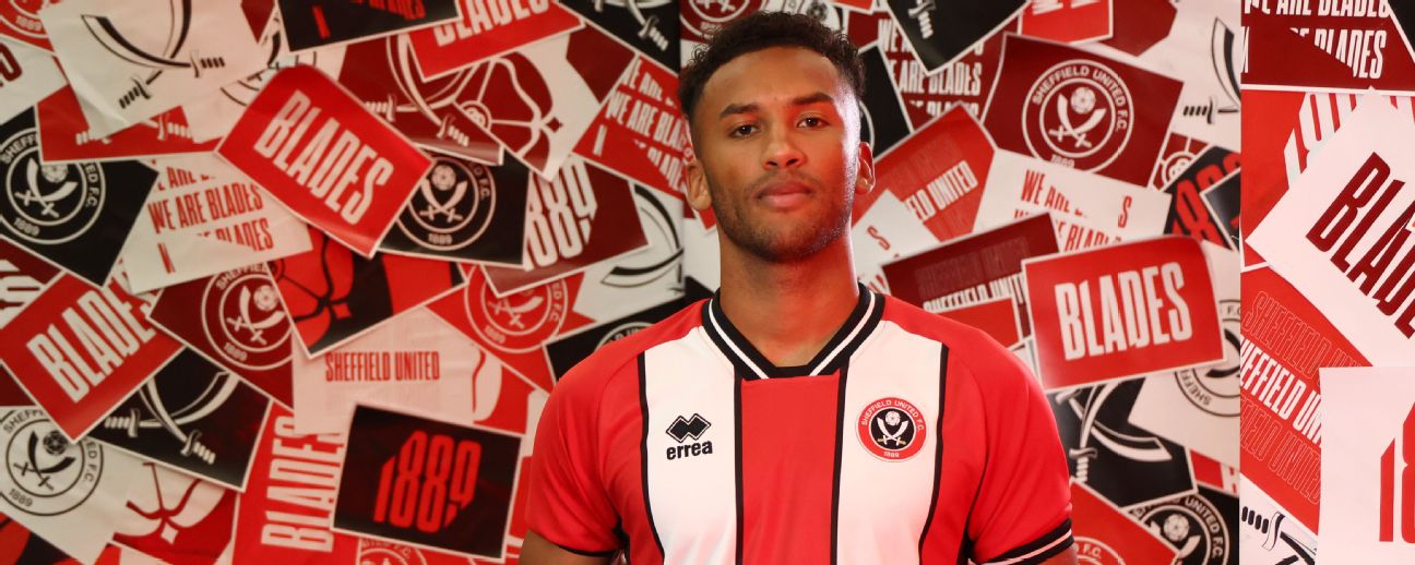 Auston Trusty poses after signing his contract on August 1, 2023 in Sheffield, England.