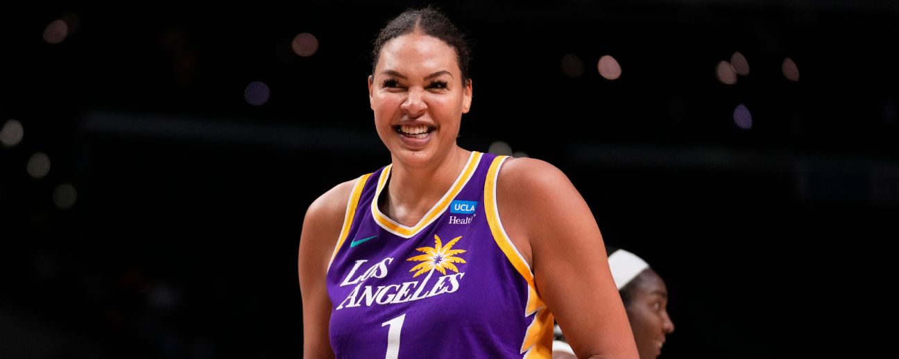 Liz Cambage poses with Los Angeles Sparks jersey during press