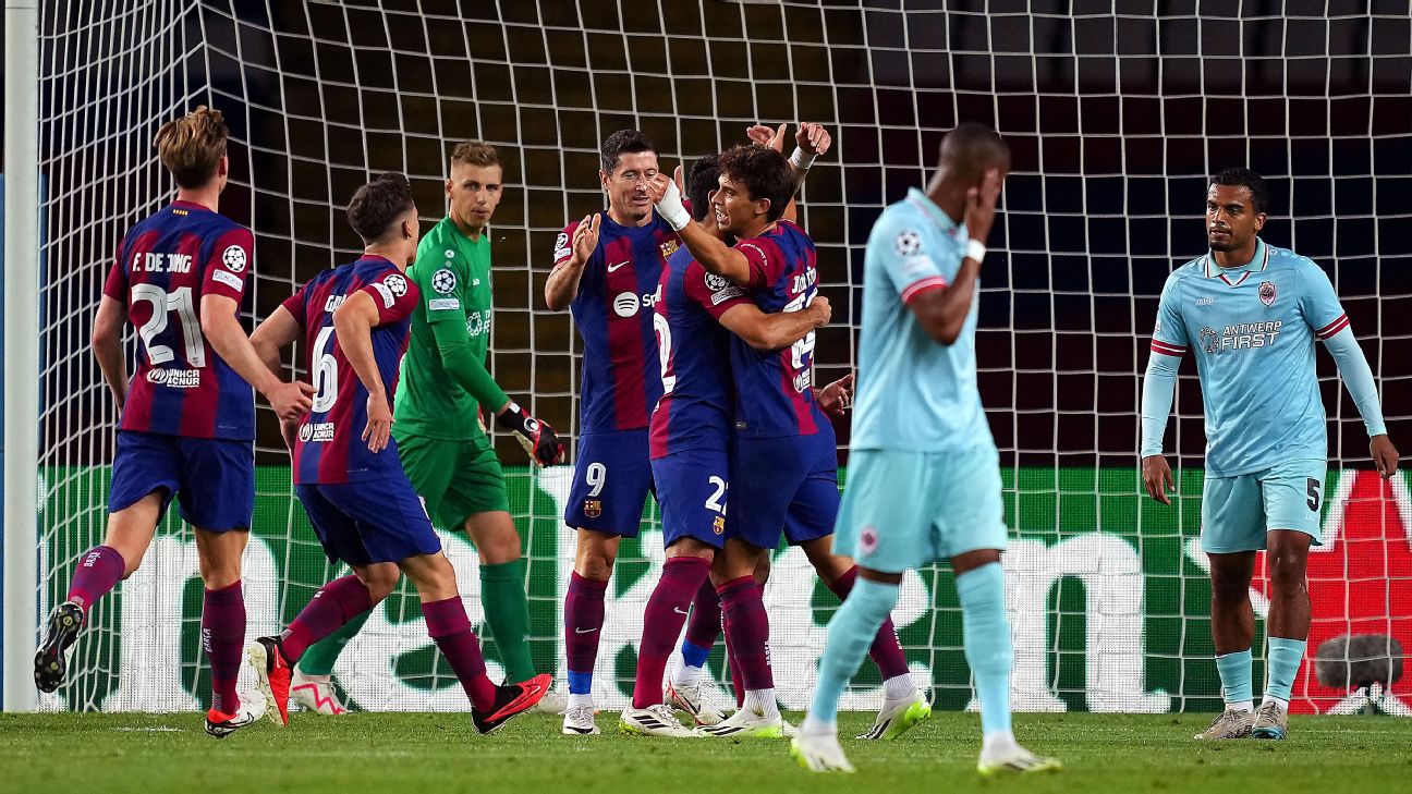Barcelona players celebrate after scoring a goal against Antwerp in the Champions League.