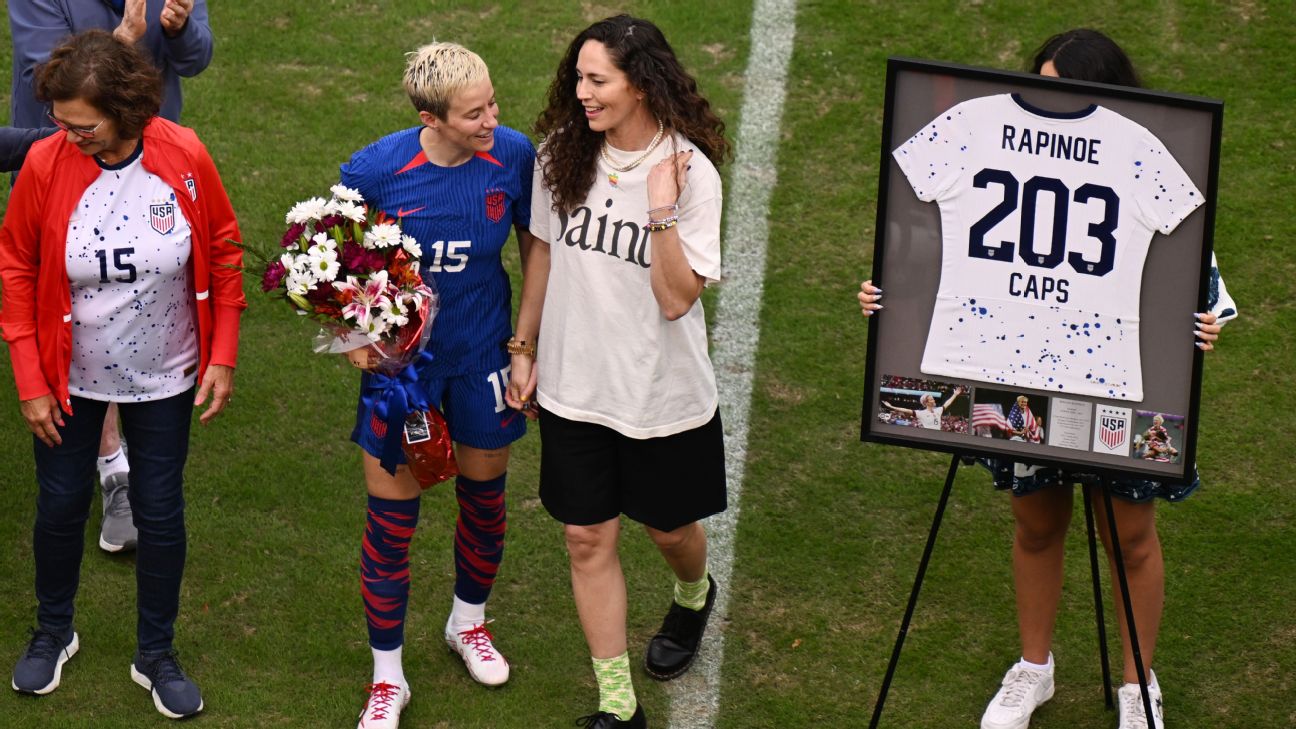 Megan Rapinoe, center, is honored before her last match with the USWNT alongside her partner Sue Bird.