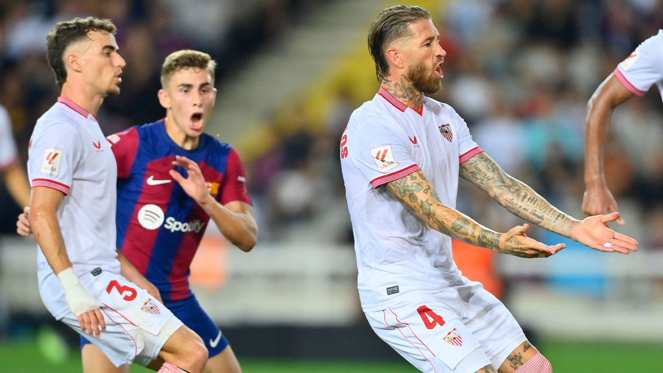Sevilla defender Sergio Ramos reacts after scoring an own goal against Barcelona.
