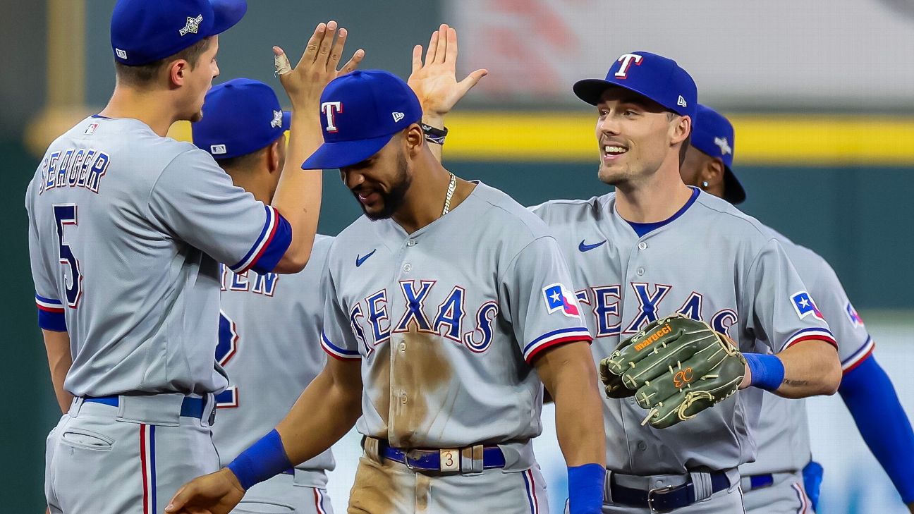 Astros fans show off their orange in Texas Rangers territory for ALCS