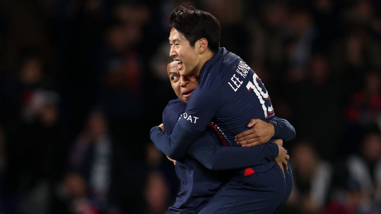 Lee Kang-In celebrates with Kylian Mbappé after opening the scoring for Paris Saint-Germain in their win over Montpellier.