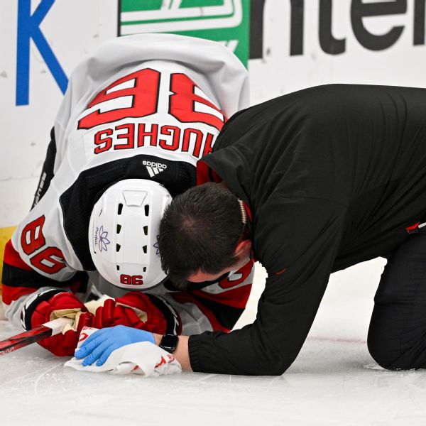 Hughes exits Devils' loss with upper-body injury