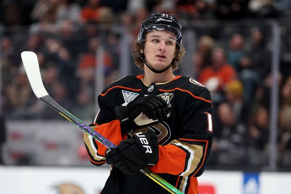 Ducks' Zegras helped off ice, 'out for a while'