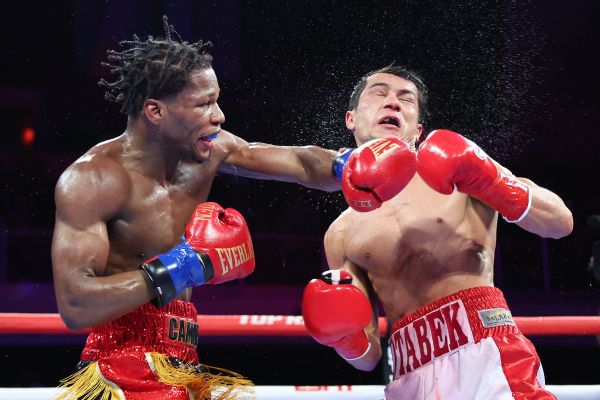 Ford, down on cards, claims title on TKO in 12th