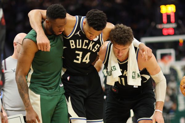 Giannis helped off with calf injury, undergoes tests