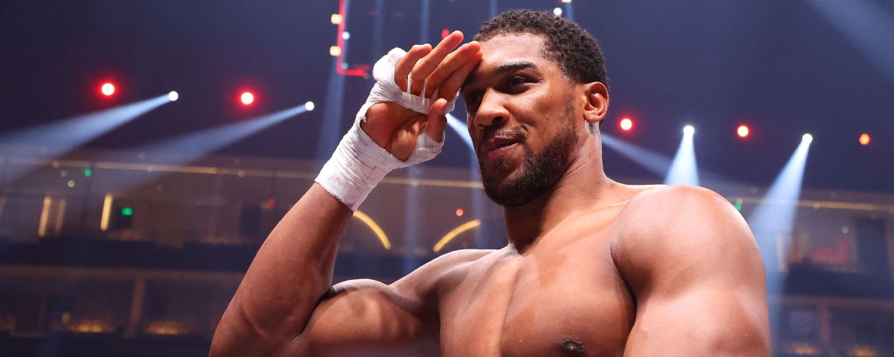 Anthony Joshua celebrates victory after the Heavyweight fight between Anthony Joshua and Francis Ngannou on the Knockout Chaos boxing card at the Kingdom Arena [1296x518]