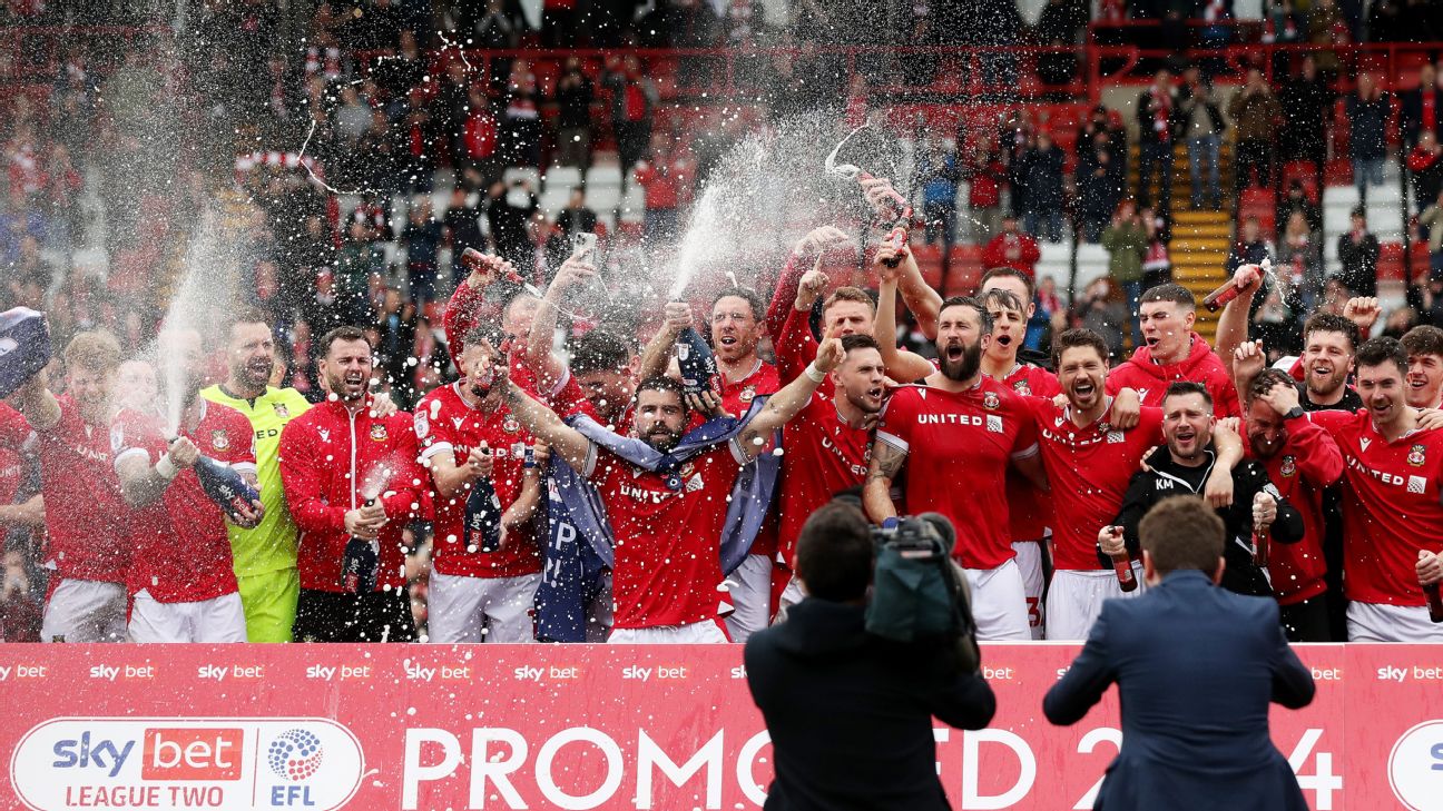 Players of Wrexham celebrate victory and promotion into League One  [1296x729]