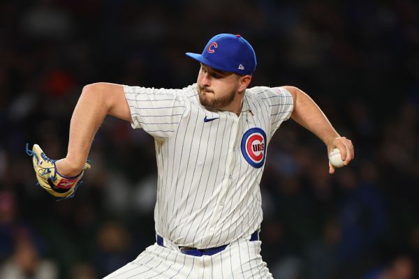 Cubs' Little told to change glove over white in flag patch