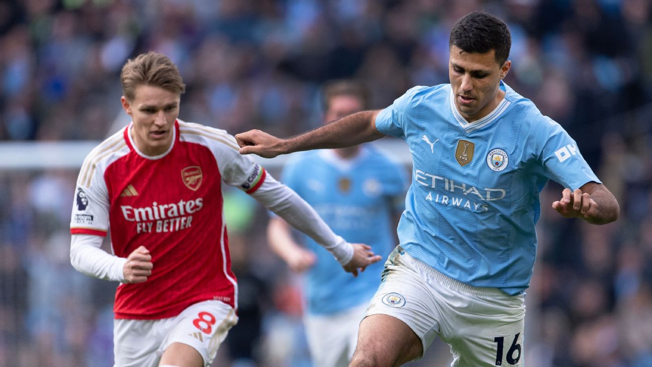 Rodri of Manchester City and Martin Odegaard of Arsenal in action during the Premier League match between Manchester City and Arsenal FC [1296x729]