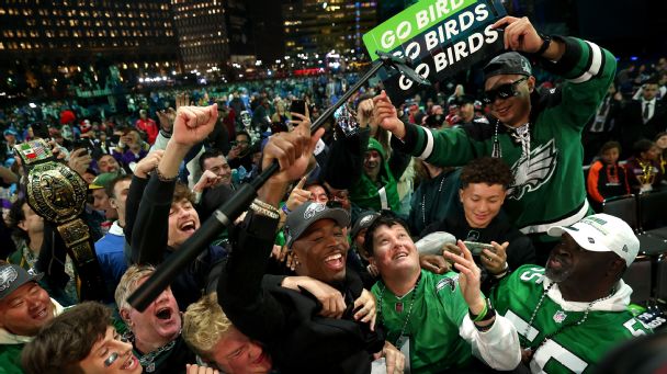 Quinyon Mitchell celebrates with fans after being selected 22nd overall by the Philadelphia Eagles during the first round of the 2024 NFL draft at Campus Martius Park and Hart Plaza on April 25, 2024 in Detroit. [608x342]