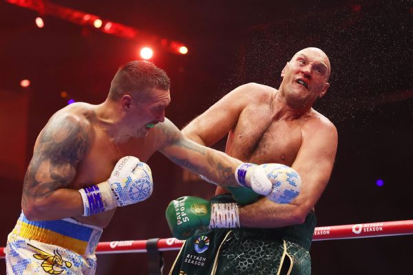 Usyk narrowly tops Fury to win undisputed crown image