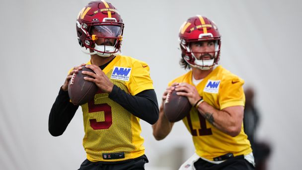 Jayden Daniels (left) and Sam Hartman of the Washington Commanders look to pass during rookie minicamp at OrthoVirginia Training Center on May 10, 2024 in Ashburn, Virginia. [608x342]