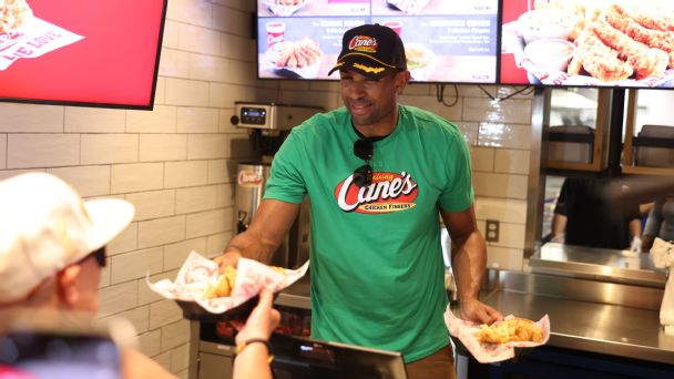 Al Horford hands out food to fans at Raising Cane's in Boston
