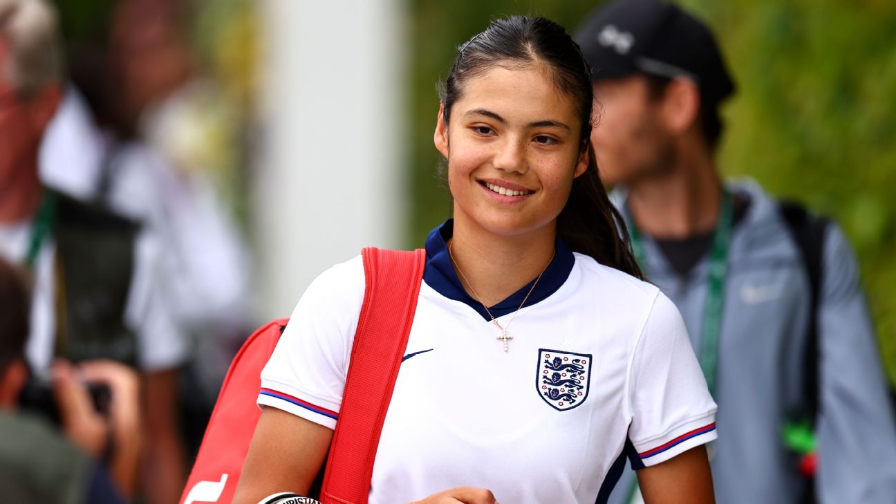 Emma Raducanu of Great Britain smiles as she walks through the grounds wearing an England Football Shirt prior to The Championships Wimbledon 2024 at All England Lawn Tennis and Croquet Club [1296x729]