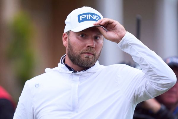 England's Brown takes Open lead in major debut