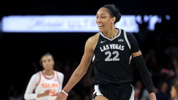 Las Vegas Aces star A'ja Wilson reacts after becoming the first WNBA player to score 1,000 regular season points.