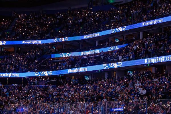 Lightning honor workers in storm-delayed opener