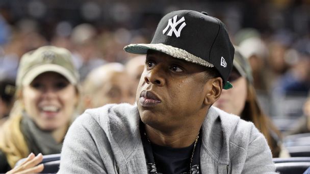 Jay-Z has long repped his hometown New York Yankees, making their fitted cap a wardrobe staple. Here, he attends Game 5 of the 2011 ALDS against the Detroit Tigers.