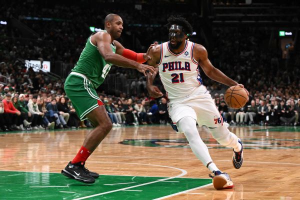 Joel Embiid drives to the basket vs. Boston Celtics at TD Garden in Boston, Massachusetts, on Dec. 25, 2024.