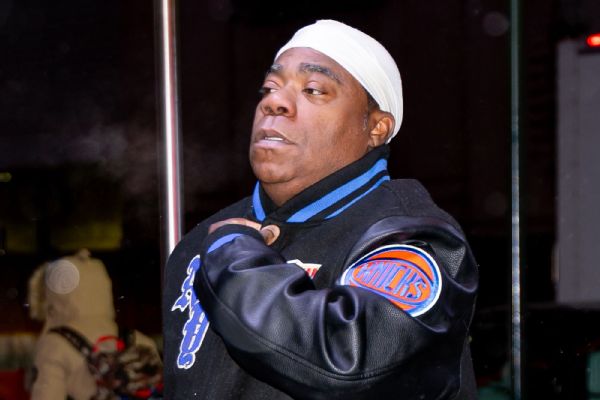 Tracy Morgan, a longtime Knicks fan, says he is OK after a bout of food poisoning resulted in him being sick during the Heat-Knicks game on Monday night. The game was stopped for more than 6 minutes during the cleanup.