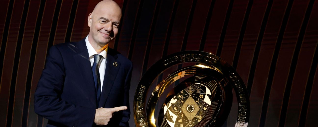 FIFA President Gianni Infantino poses for a photo whilst pointing at The FIFA Club World Cup Trophy during the reception after the 2025 FIFA Club World Cup Draw at Telemundo Studios

