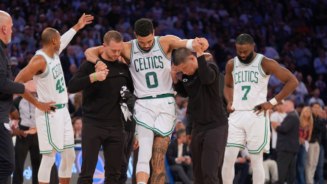 Jayson Tatum is helped off the court after an injury in Game 4.