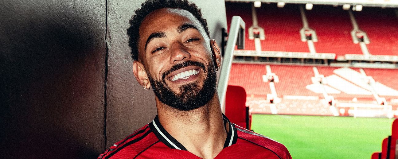 Matheus Cunha of Manchester United poses for a photo after signing his contract with the club at Old Trafford on June 12, 2025 in Manchester, England