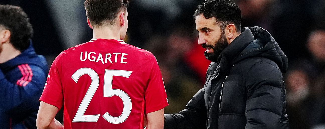 Manchester United manager Ruben Amorim (right) speaks with Manuel Ugarte on the touchline during the Carabao Cup quarter-final match at the Tottenham Hotspur Stadium, London. Picture date: Thursday December 19, 2024.