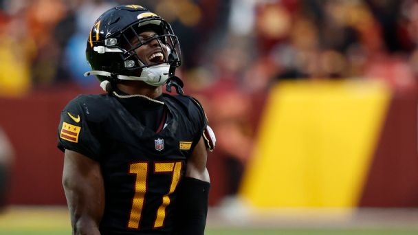 Washington Commanders wide receiver Terry McLaurin (17) reacts after making a catch against the Tennessee Titans during the fourth quarter at Northwest Stadium.