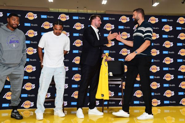 Marcus Smart, Gabe Vincent and Maxi Kleber (from left to right) were among the Lakers on hand for newly extended Luka Doncic's news conference Saturday.