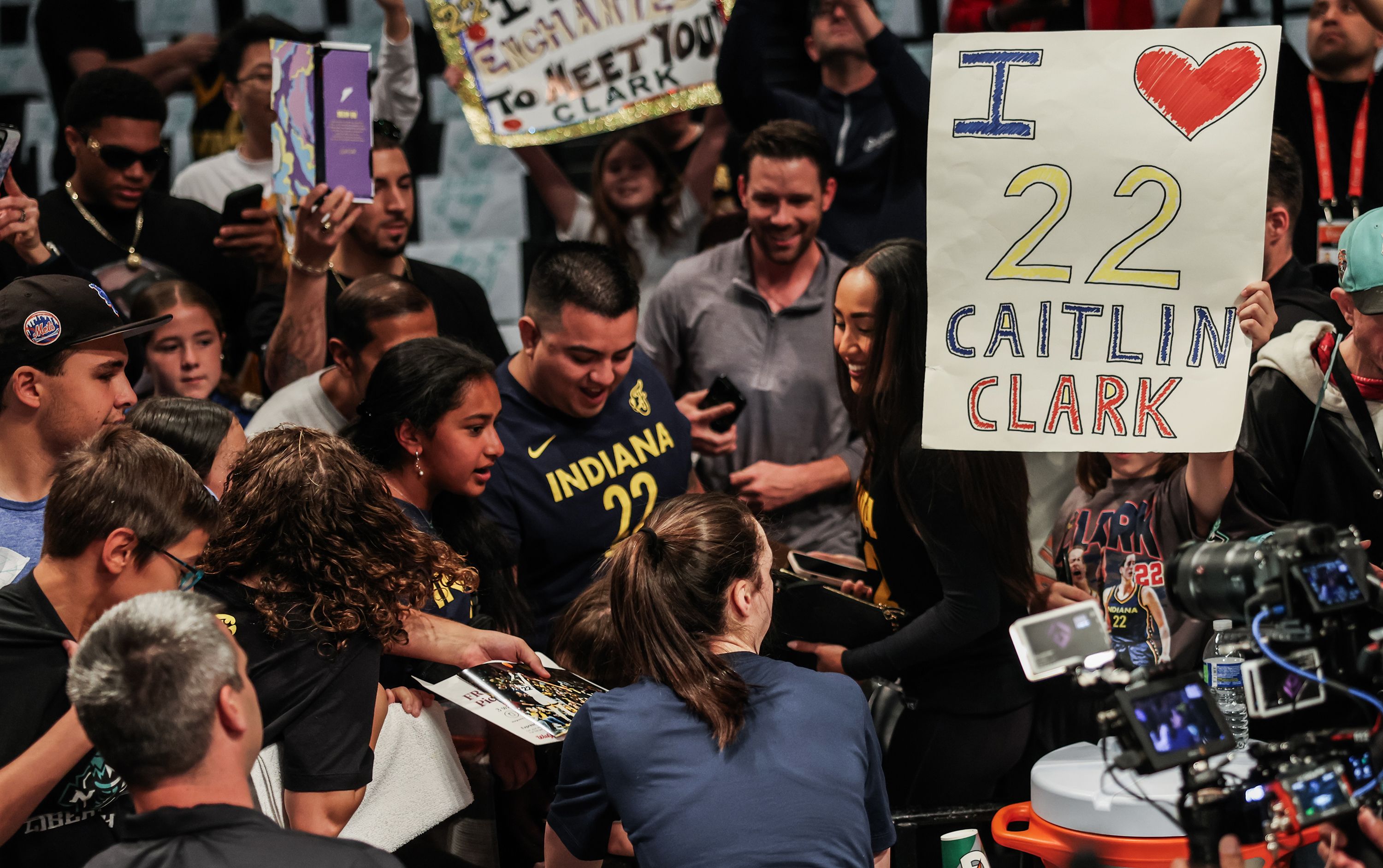 Clark struggles knowing she can't sign autographs for all of her fans each night. "I always try to take 10-15 minutes to sign on the way in," Clark says. "All of these people come here and spend a lot of time and money, and they're so excited." — Article image accompanying Caitlin Clark and the most exciting warmup routine in sports on WagerUp Sports News. Clark struggles knowing she can't sign autographs for all of her fans each night. "I always try to take 10-15 minutes to sign on the way in," Clark says. "All of these people come here and spend a lot of time and money, and they're so excited." — Article image accompanying Caitlin Clark and the most exciting warmup routine in sports on WagerUp Sports News.