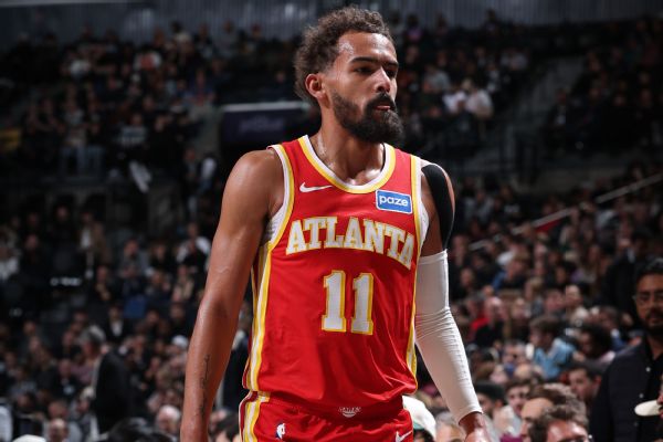 Hawks' Trae Young exits game at Nets with right knee sprain