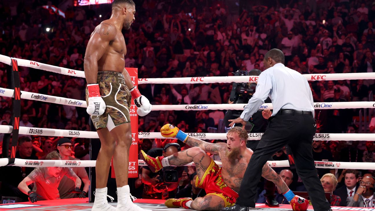Joshua bides time, batters Paul in sixth-round KO