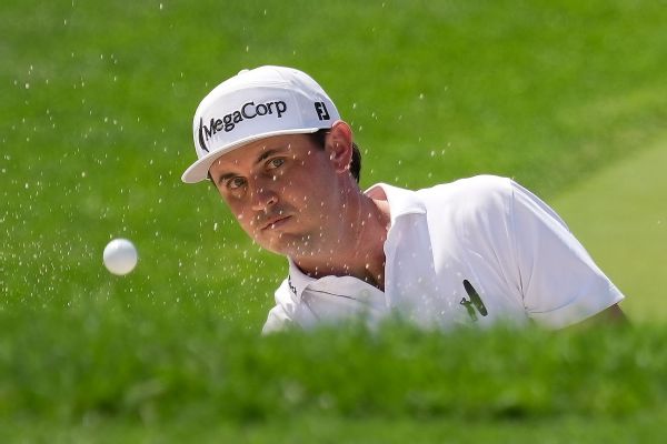 J.T. Poston handles wind at Memorial for 65, tournament lead