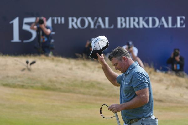 Ryan Fox tips his cap to the crowd at Royal Birkdale after carding a record-tying 8-under 62 on Saturday in third-round play at the Open Championship. — Article image accompanying Fox's 62 matches major record, the third at this week's Open on WagerUp Sports News.
